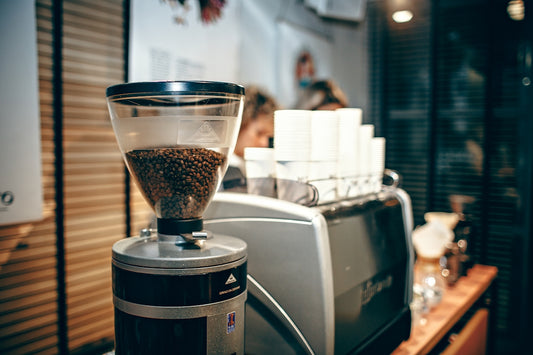 silver and black coffeemaker on table
