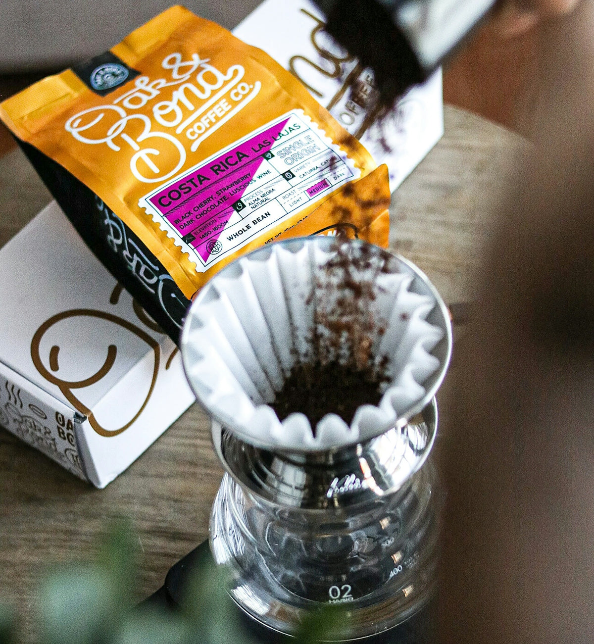 a bag of coffee sitting on top of a wooden table