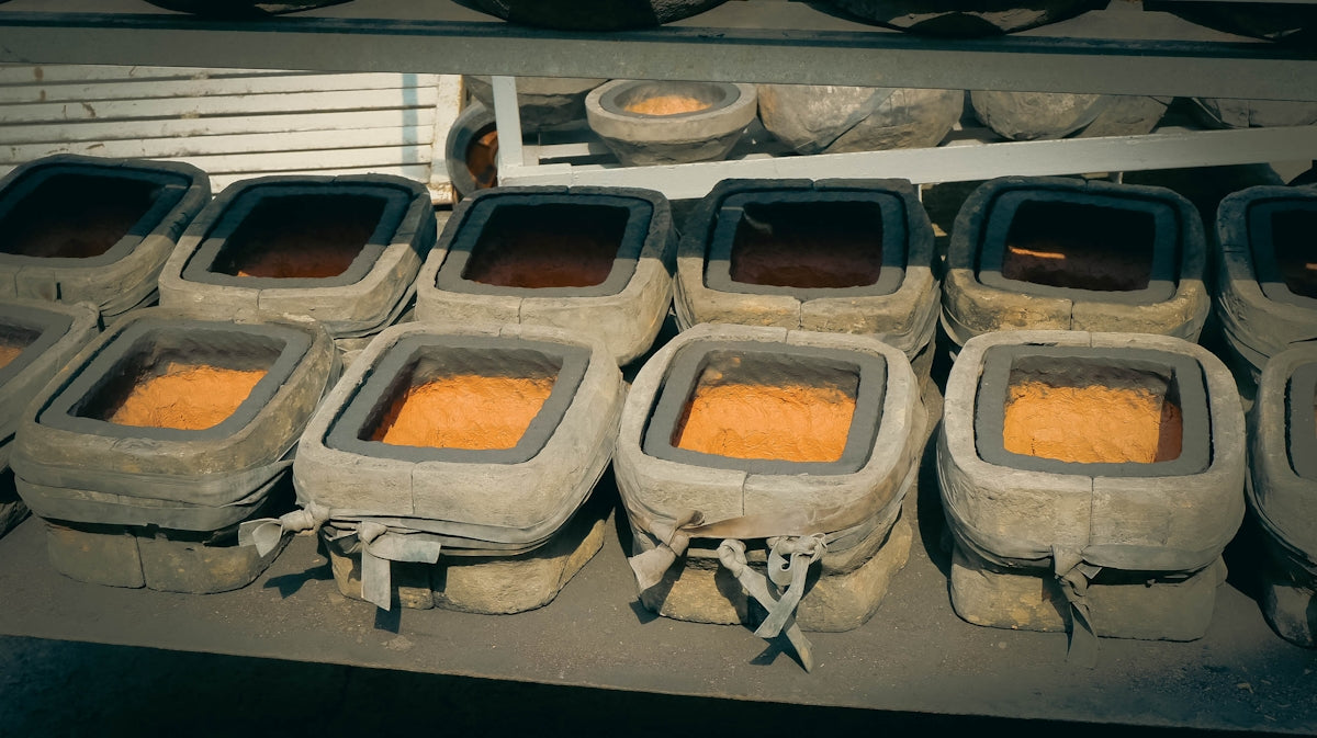 a group of cement containers filled with food