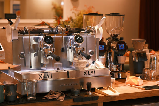 A coffee machine sitting on top of a wooden counter