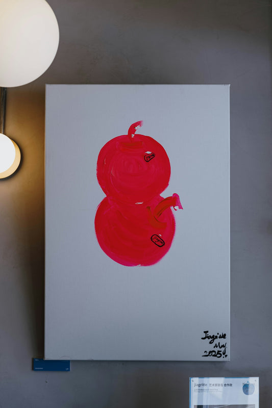 A red abstract painting of two spheres.