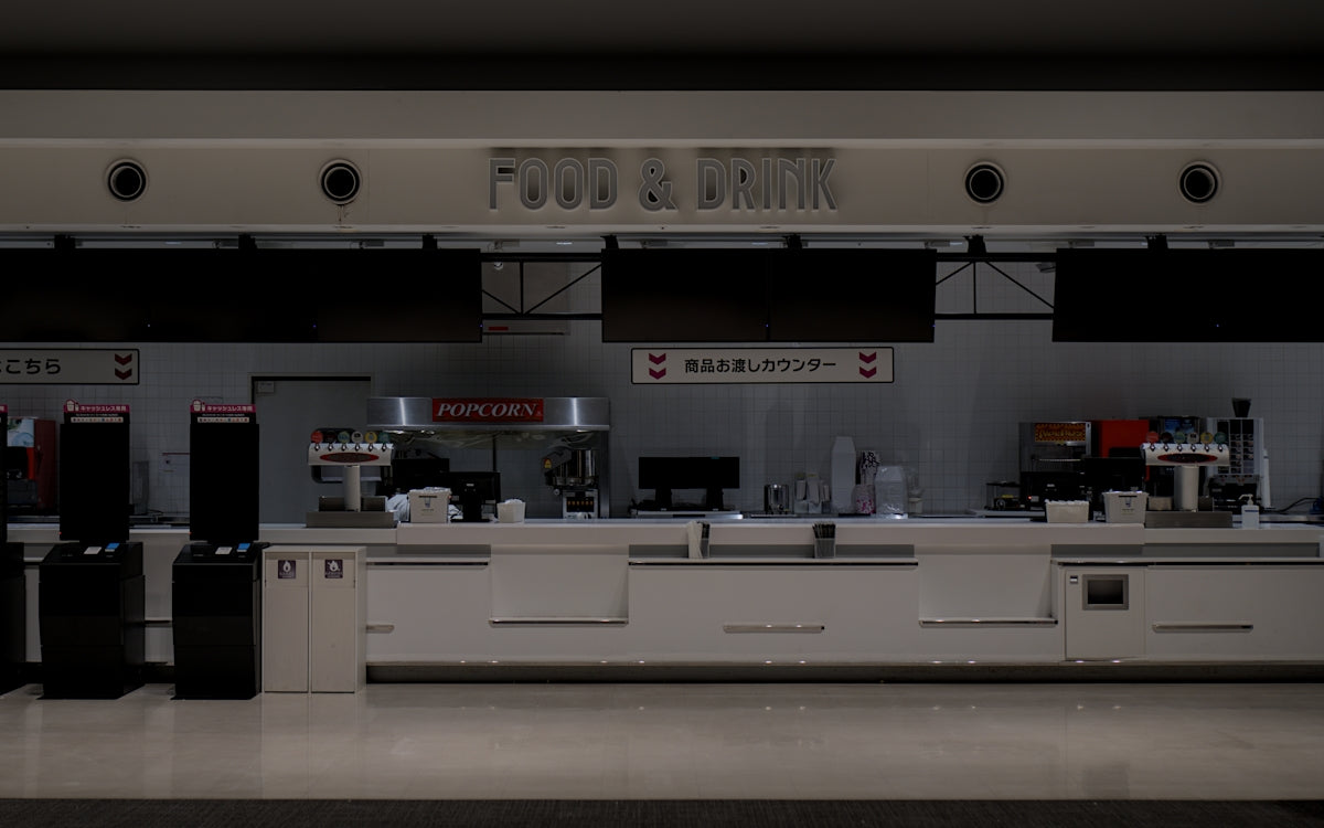 Empty airport check-in counters with luggage